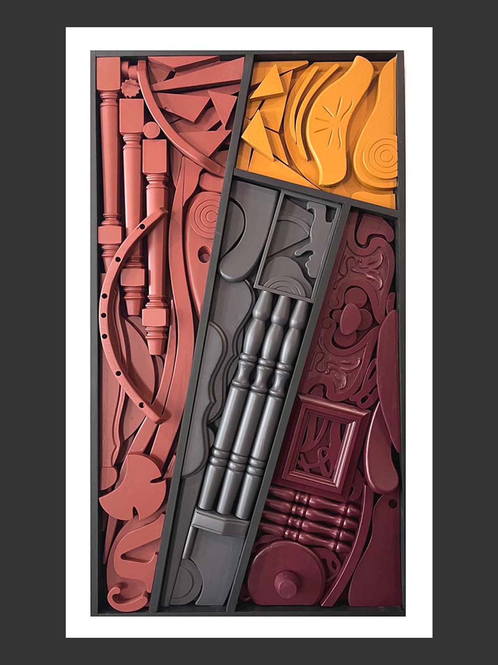 A colorful abstract composition made of repurposed wood featuring various geometric shapes and forms in red, orange, and gray tones, arranged in a rectangular frame by David Furman.