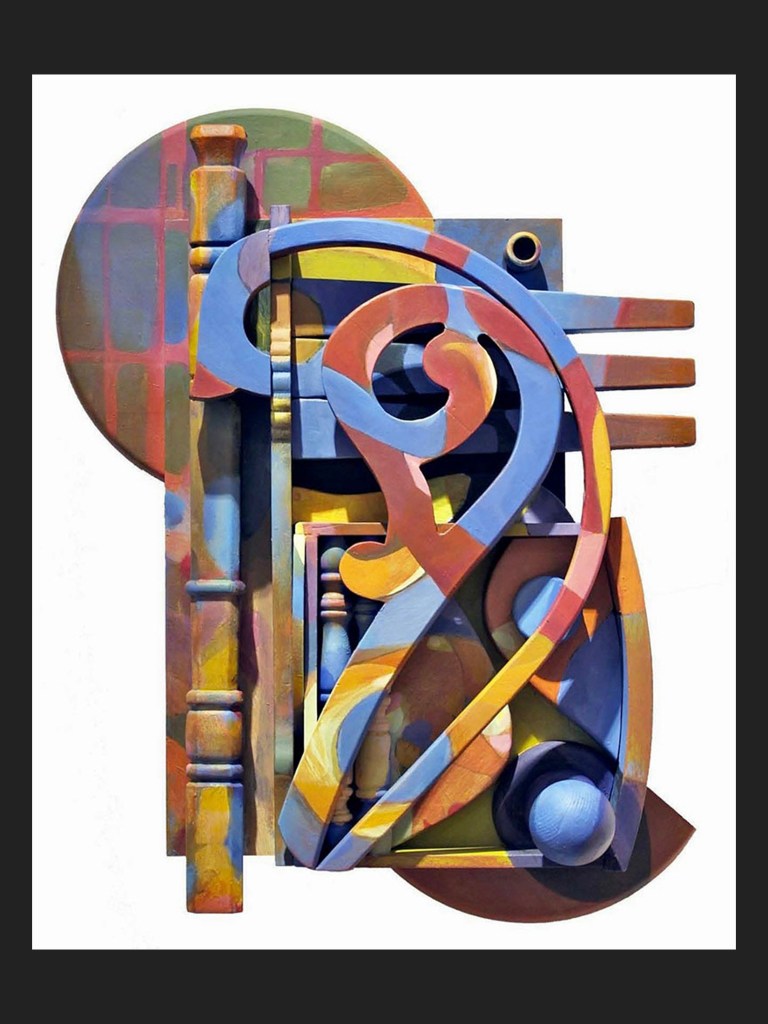 An abstract composition wall sculpture made from reclaimed wooden elements and featuring colorful geometric shapes and forms, including curves and circles, with a variety of textures and layers, painted blue, green, yellow, and red by David Furman