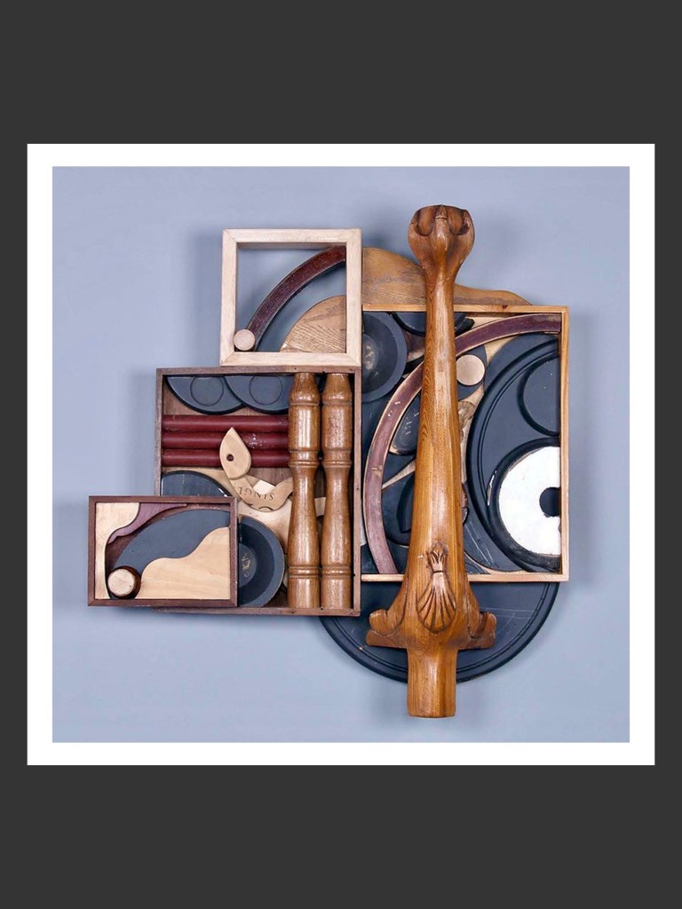 A colorful wooden wall sculpture art piece made out of reclaimed wooden elements composed of various shapes, textures, and colors, featuring geometric patterns and organic forms by David Furman