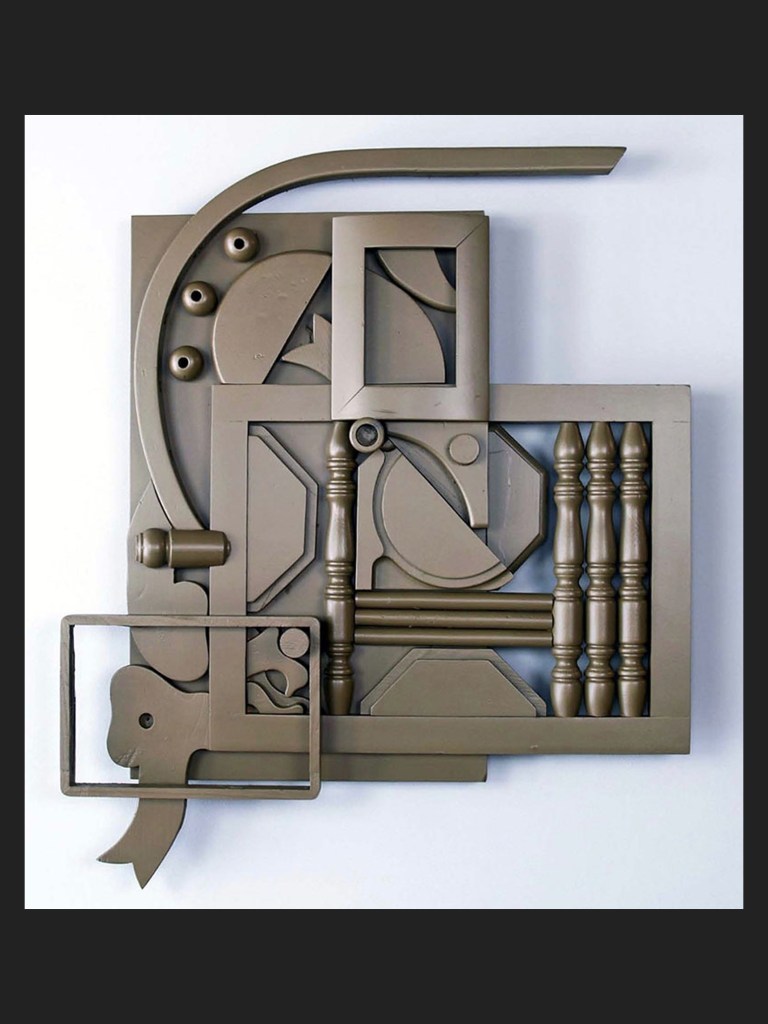 Abstract wall art sculpture made from reclaimed wood and composed of various geometric shapes and textured panels in a mute green tone by David Furman