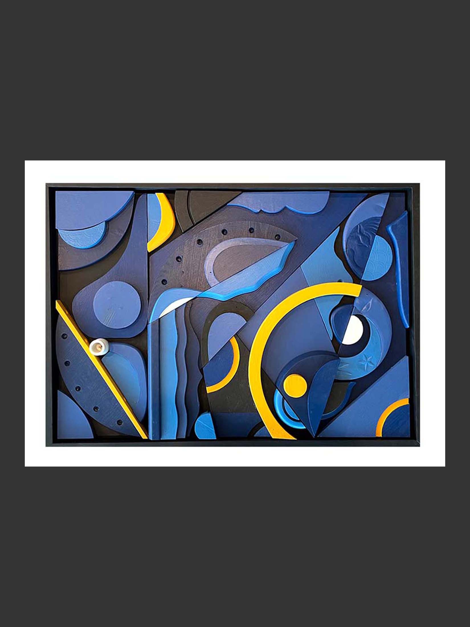 An abstract art piece inspired by the night made of repurposed wood and featuring layered geometric shapes in blue, black, and yellow colors by David Furman.