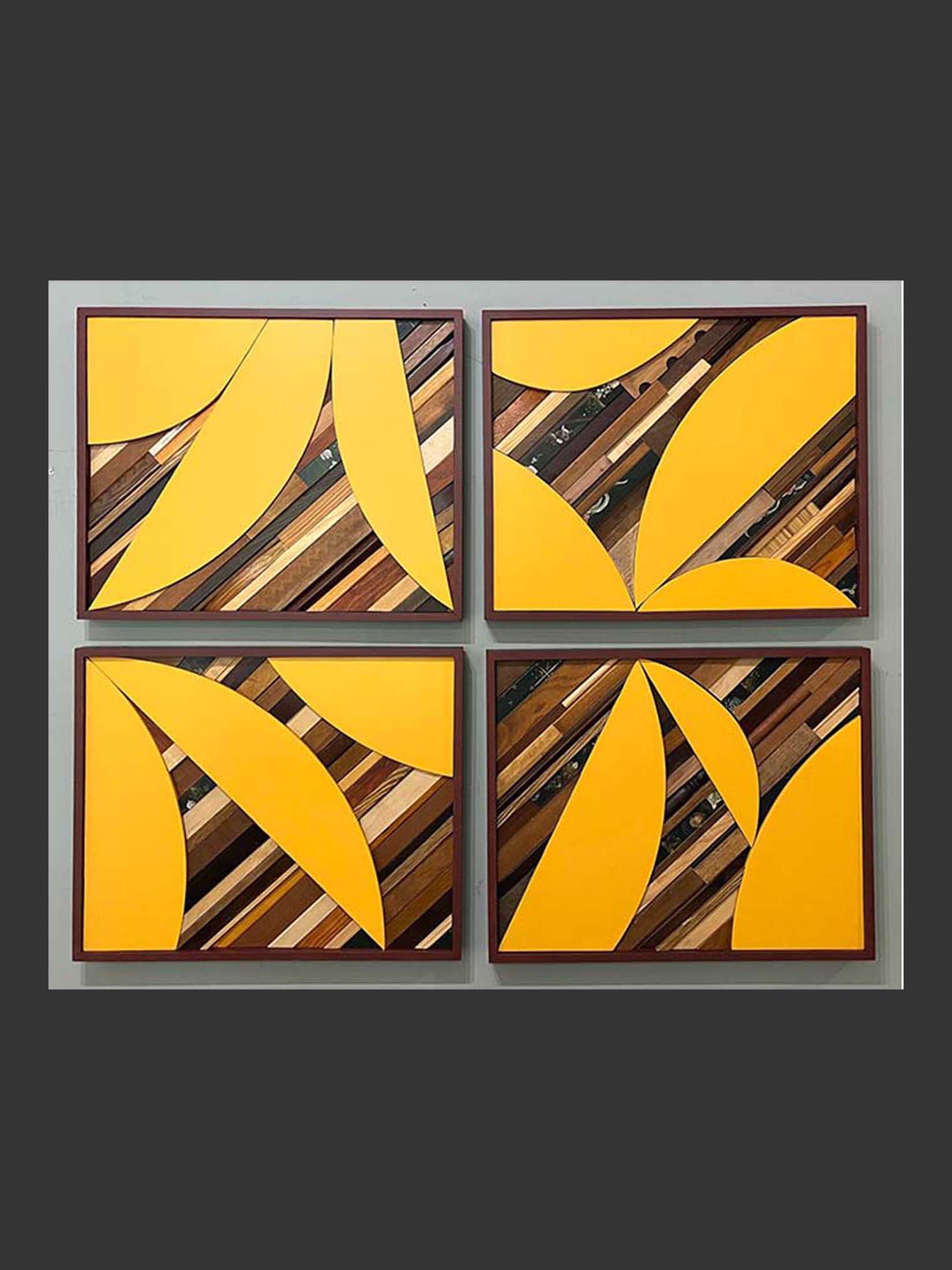 A four-panel abstract wall art piece made of repurposed wood featuring large yellow shapes on a background of wooden strips by David Furman.