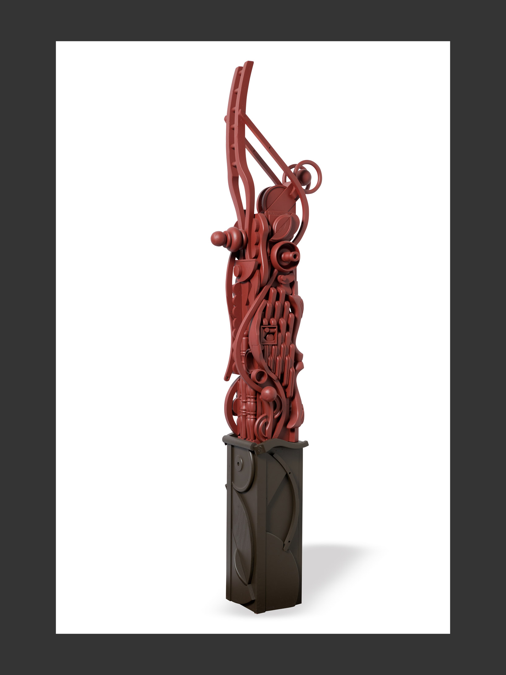 A modern sculptural artwork, or “Totem”, made of repurposed wood featuring a tall, intricate design in red set atop a dark base, showcasing abstract shapes and forms by David Furman.