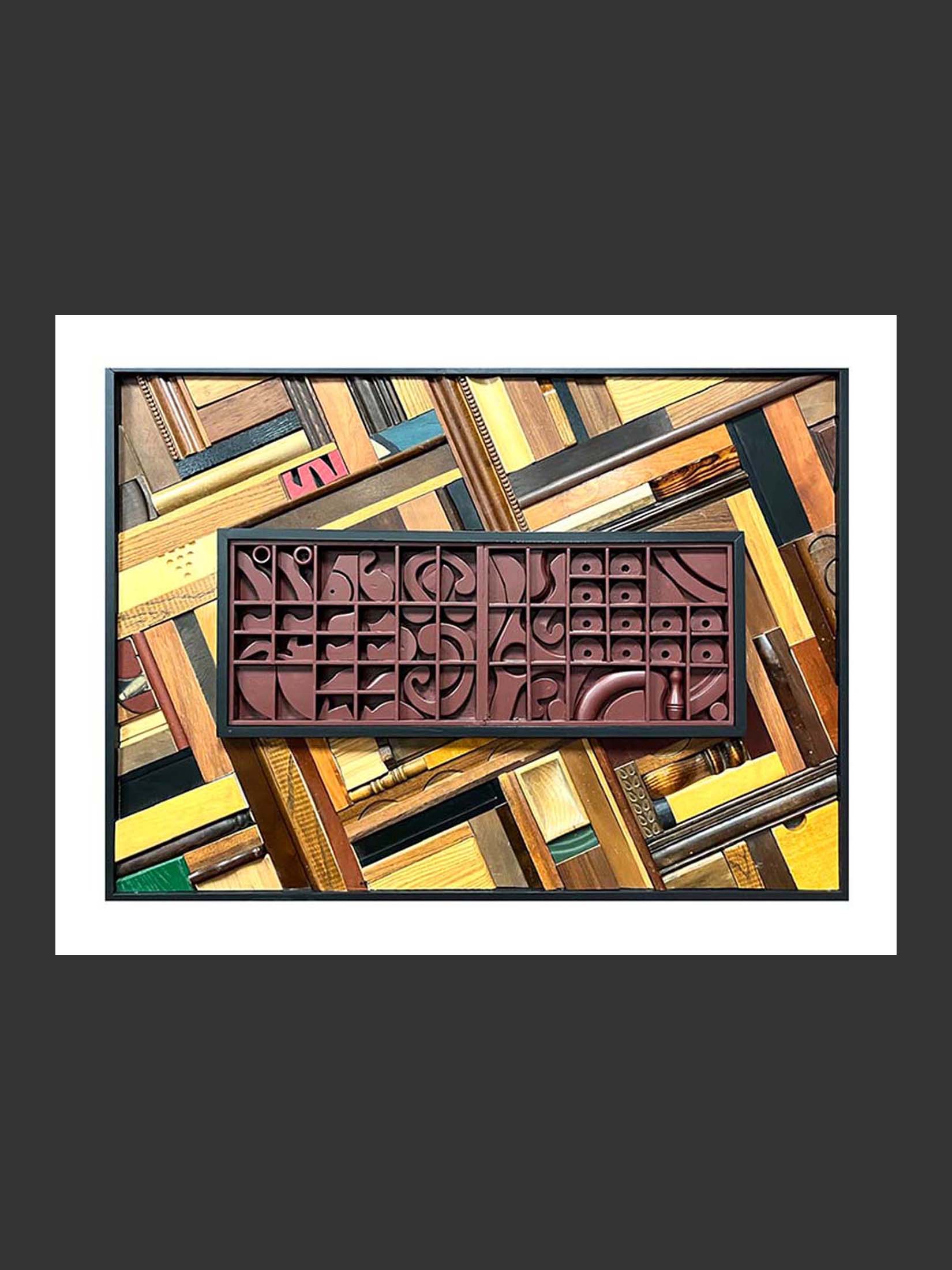 An artistic arrangement of reclaimed wood of different colors and forms with a central painted rectangular section of assorted abstract shapes in the center by David Furman.