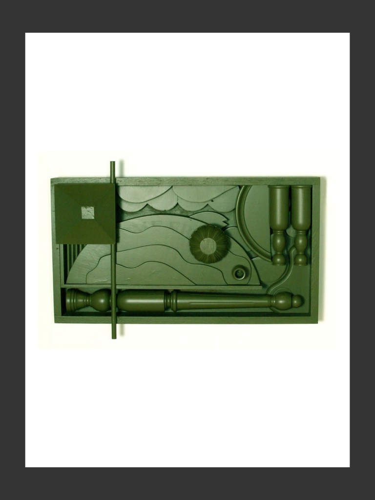 A wall sculpture display made from reclaimed wood and featuring various green sculptural forms arranged in a rectangular panel, depicting abstract shapes and elements by David Furman