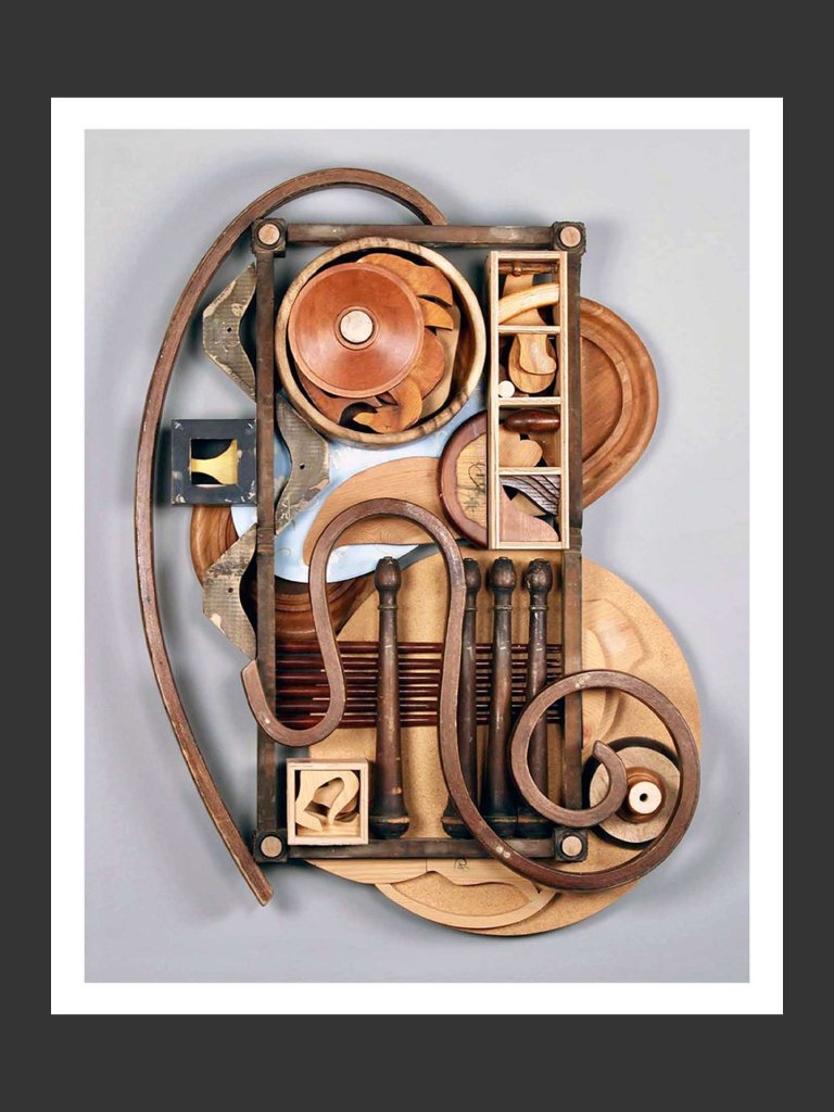 A colorful wooden wall sculpture art piece made out of reclaimed wooden elements composed of various shapes, textures, and colors, featuring geometric patterns and organic forms by David Furman